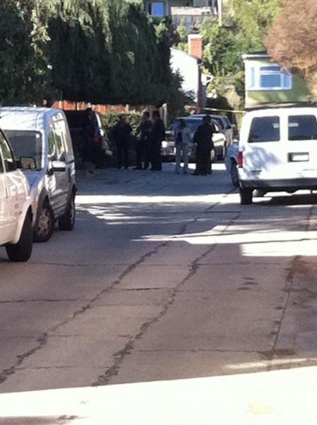 Police gather outside Gatto's father's home. (Madison Sanders / ATVN)