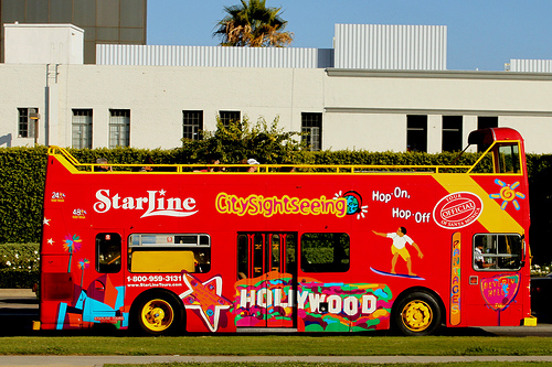 Tour bus operators can no longer advertise on the sidewalk. (Prayitno/Flickr)