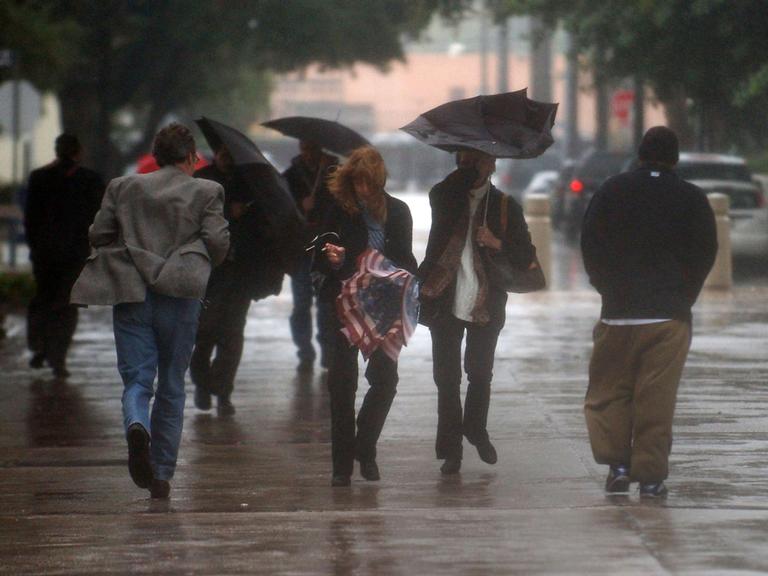 Los Angeles residents have braved rainy weather, but can expect sunnier weather in the coming week (AP).