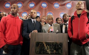 Derek Fisher (left) and Billy Hunter with players (Associated Press)