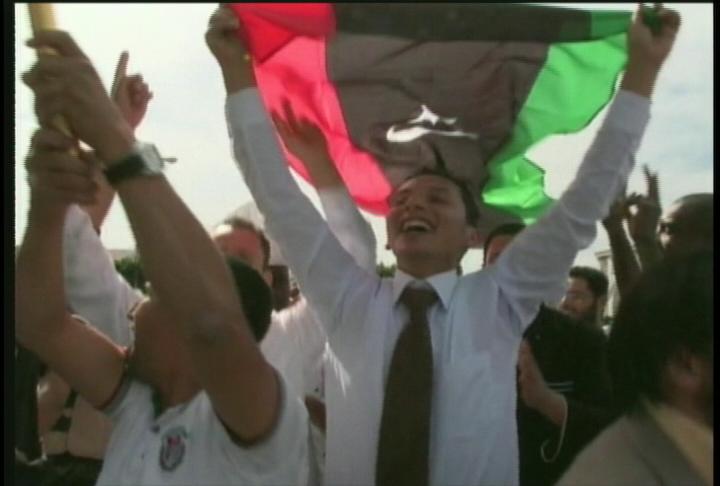 Libyans celebrate the news of dictator Moammar Gadhafi's death.