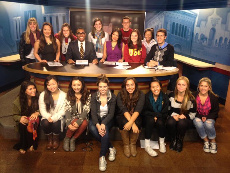 Team Wednesday poses at the news desk after completing a semester's worth of shows. (John Goldsmith/ATVN)