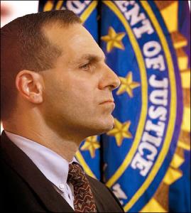 Louis Freeh stands near the FBI flag in a ceremony honoring the FBI's new labatory in Quantico, Va./ AP