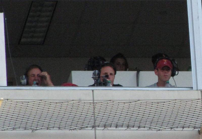 Monte Kiffin, left, calls plays from the coaches box during the USC fall scrimmage
