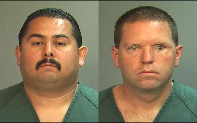 Officers Manuel Ramos and Jay Cicinelli. (Orange County District Attorney's Office)