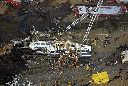 Firefighters work to rescue trapped passengers after a MetroLink commuter train collided with a freight train in Chatsworth on Sept. 12, 2008. (Associated Press)