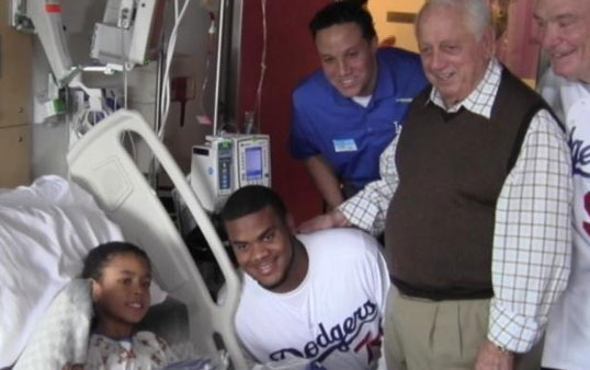 Tommy Lasorda and other current and former Dodgers visited children in hospitals on Tuesday
