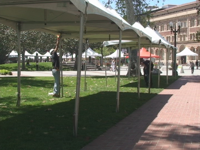 A volunteer works to set up the 2012 Los Angeles Times Festival of Books. (ATVN)