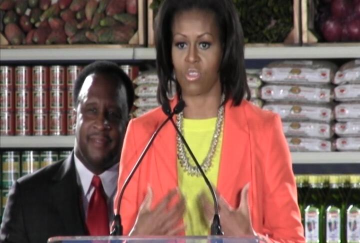 First Lady Michelle Obama speaks at a local market  (photo courtesy of ATVN)