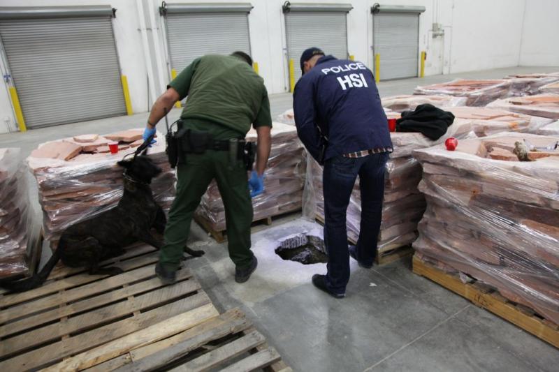 Investigators survey the entrance to the drug tunnel. (Image courtesy San Diego Tunnel Task Force)