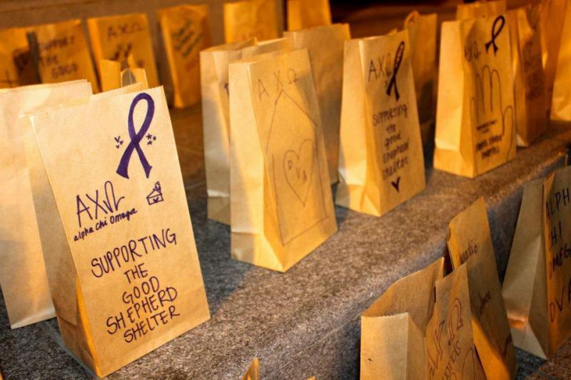 The sorority makes lumanaria and lights candles for the victims of domestic violence.