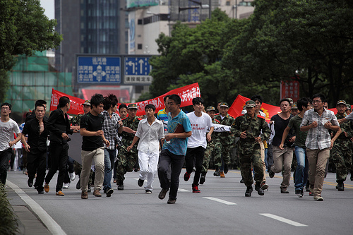 Anti-Japanese protestors in Suzhou, China. (Courtesy of Flickr User markboltonphotography.com)