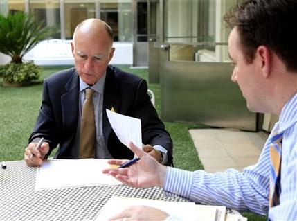  Gov. Jerry Brown and Aaron Maguire, Brown's deputy legistlative affairs secretary