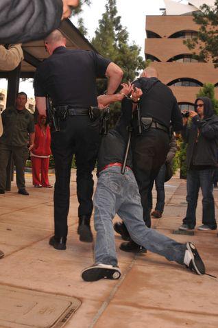 Police arrest an Occupy Riverside protestor (Facebook)