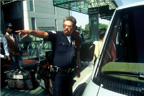 An LAX police officer directs passengers. (Photo courtesy of Los Angeles World Airports)