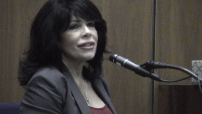 Luisa Aznarez, an AT&T retail sales manager, explains cell phone coding. 