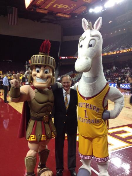 Tommy and Traveler make their debut standing alongside USC Athletic Director Pat Haden.