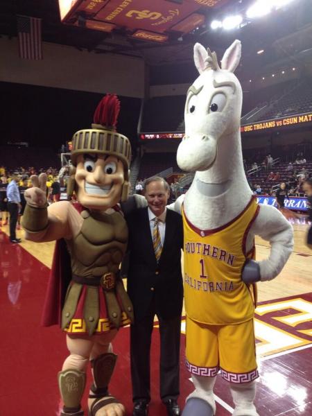 Tommy and Traveler make their debut standing alongside USC Athletic Director Pat Haden.