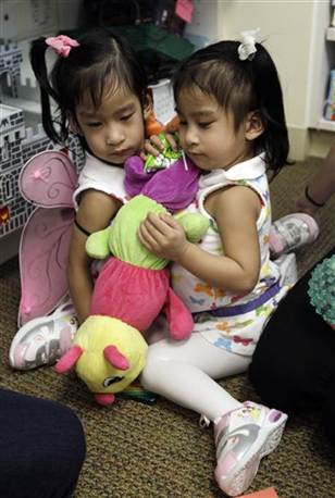 The Sabuco twins play together at the Lucile Packard Children's Hospital, Monday, in Stanford, Calif. (Courtesy AP)