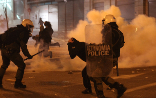 Police and rioters clash in Athens on Monday.  (Photo courtesy AP)