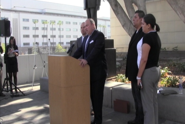 Attorney John Manly addresses the press while Michal Duran and his wife wait to the side. (Tiara Chiramonte/ATVN)