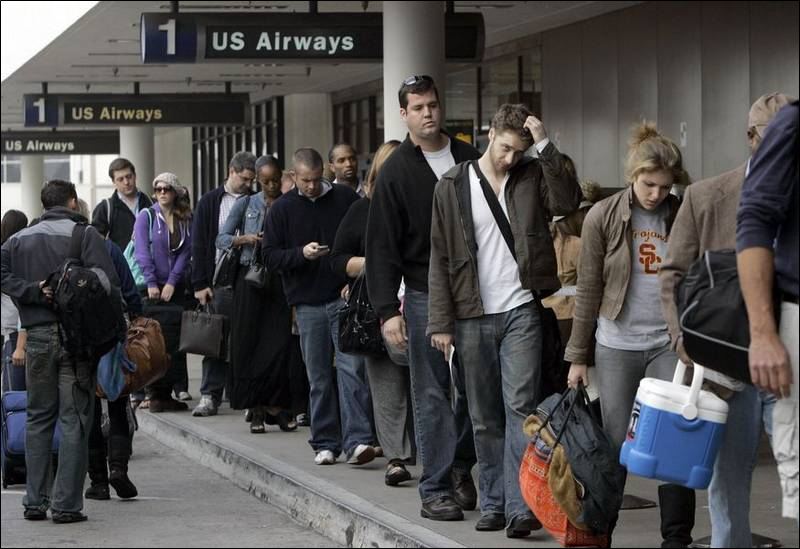 Travelers await their flights outside LAX.