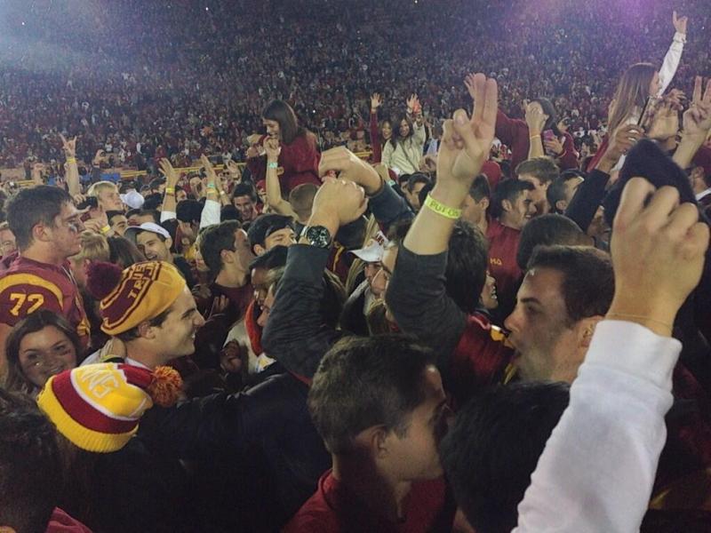 USC fans storm the field after the Trojans' upset win over Stanford. (Sarah Bergstromm/Twitter)