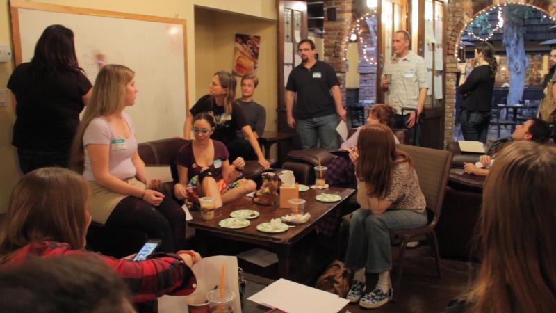 During the TGIO (Thank God It's Over) party, writers share their work between cake, conversation and cups of coffee (Cameron Quon/ATVN).