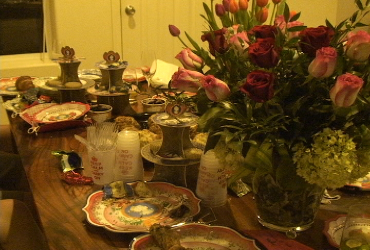 Prince William and Kate Middleton memorabilia decked out this party table, along with scones and fresh flowers.